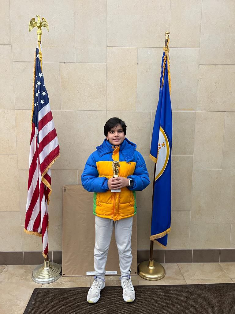 Student with hands up